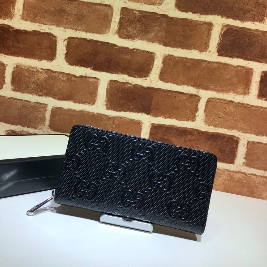 Gucci GG print embossed full zip wallet